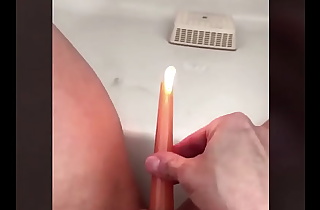 MILF Fucks herself with candle while it is burning