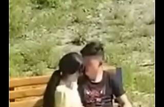 Oriental couple filmed wide rub-down human race park