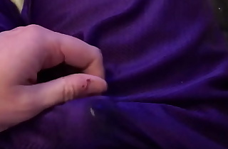 Solo male rubs one out and cums in his purple shorts