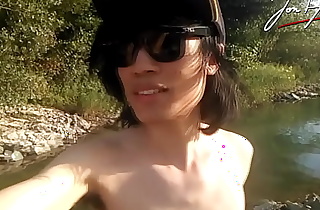 Jon Arteen is this slim Asian twink boy dancing a musical strip-tease on the river smiling showing his full pubes doing outdoor gay porn with a sneaker and underwear fetish