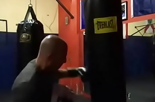 MAXXX LOADZ WORKING OUT ON HEAVY BAG WITH BOXING GLOVES ON STRIKING THE BAG