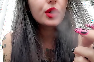 Smoking fetish from Dominatrix Nika. The Dominatrix smokes sexy and blows smoke in your face.