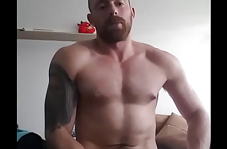 Muscular guy is jerking off in home