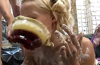 Kinky blonde girl gets her sexy body covered in food