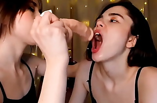 Destroying her throat with a big dildo