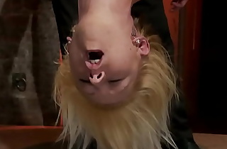 Blond in upside down suspension whipped