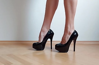 Footjob with sexy black high heels